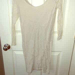 Cream colored body con lace dress